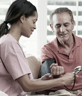 A caregiver spending time with a senior at home